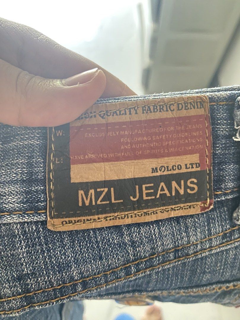 MZL Jeans Denim Mini Skirt (Category: Skirts) located in Batangas. Submitted by bmrlne (Listing ID 1453098122, Image 2). Description: - Brand: MZL Jeans - Style: Blue denim mini skirt - Features: Classic five-pocket design, zip fly - Wash: Distressed for a vintage look - Occasion: Great for casual wear - Versatility: Easy to pair with various tops.