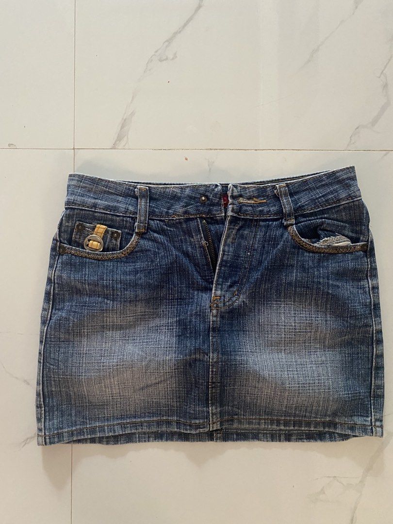 MZL Jeans Denim Mini Skirt (Category: Skirts) located in Batangas. Submitted by bmrlne (Listing ID 1453098122, Image 1). Description: - Brand: MZL Jeans - Style: Blue denim mini skirt - Features: Classic five-pocket design, zip fly - Wash: Distressed for a vintage look - Occasion: Great for casual wear - Versatility: Easy to pair with various tops.