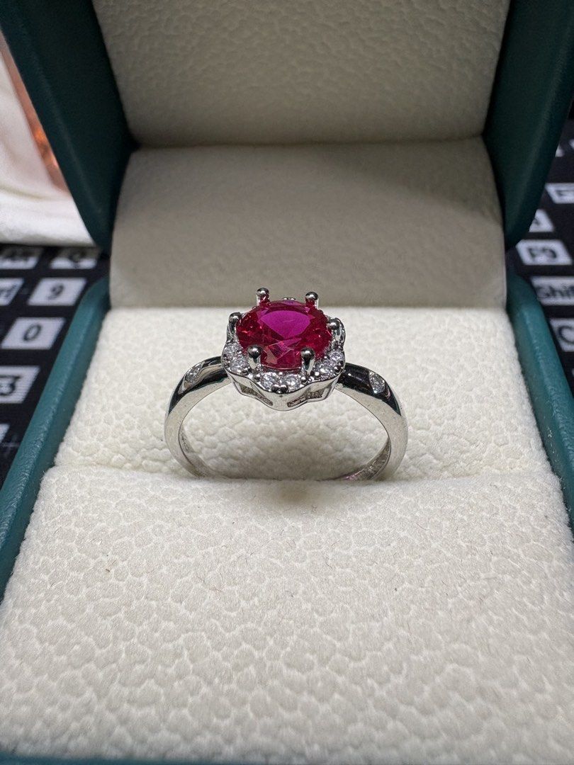 Natural Ruby Ring (Category: Rings) located in Singapore. Submitted by Discoverme (Listing ID 1453198522, Image 2). Description: ❤️ Natural Ruby Ring – S925 Sterling Silver ❤️ A timeless and elegant ring showcasing a vibrant Natural Ruby, beautifully framed by a halo of shimmering accent stones. Crafted in genuine S925 sterling silver, this classic design enhances the ruby’s rich red colour, making it perfect for everyday elegance or special occa