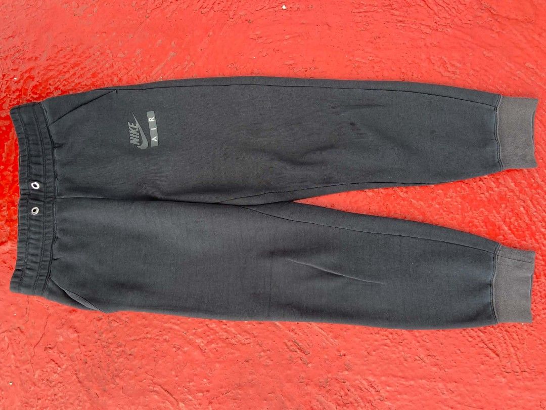 Nike Air Black Jogger Sweatpants (Category: Joggers) located in Manila. Submitted by lemlem_10 (Listing ID 1453140193, Image 2). Description: - Black Nike Air sweatpants - Elastic waistband with drawstring - Cuffed ankles - Large 'AIR' graphic and Nike logo down the side - Comfortable and stylish - Ideal for lounging or workouts.