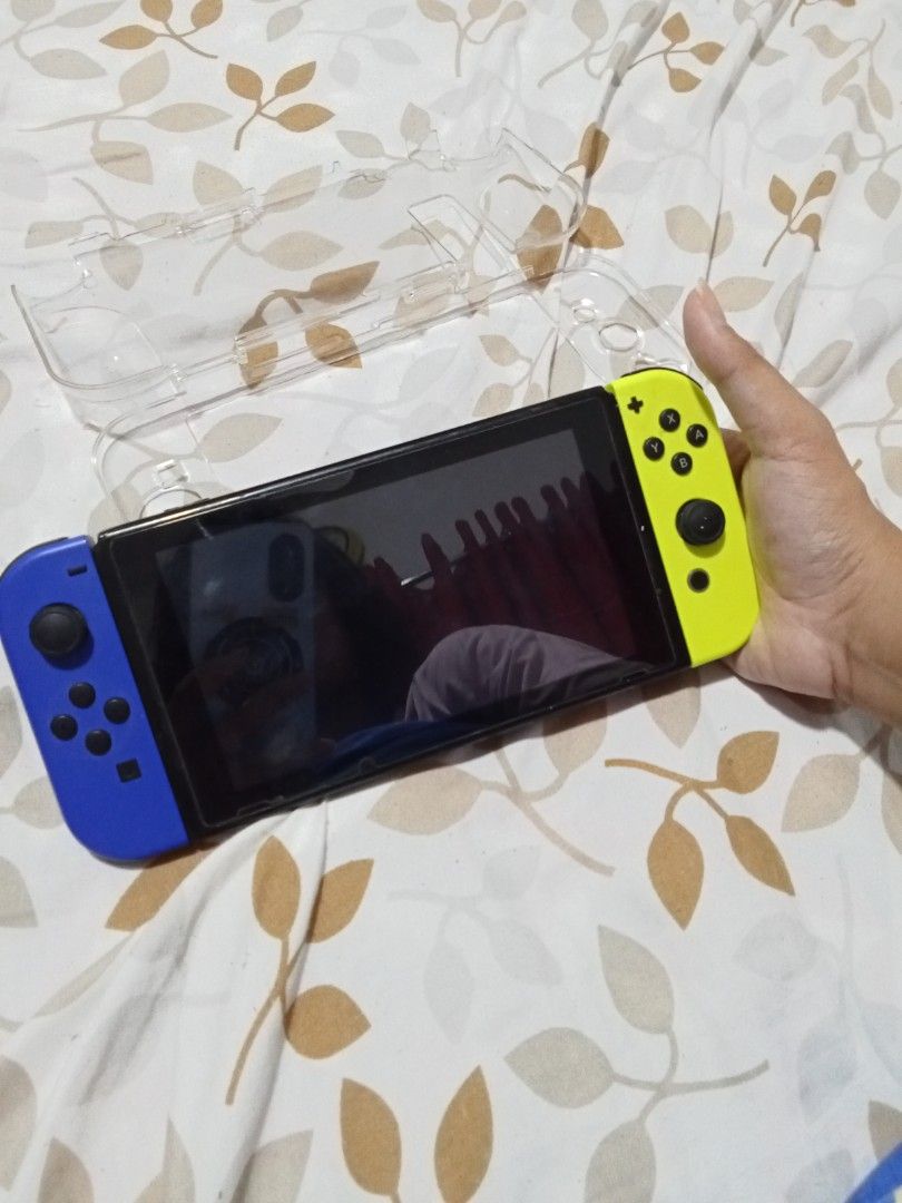 Nintendo Switch Console - Blue & Yellow Joy-Cons (Category: Nintendo) located in Rizal. Submitted by nykeri (Listing ID 1453122725, Image 1). Description: - Nintendo Switch Console - brandnew Blue and Yellow Joy-Cons - Includes clear protective case - Minor scuffing and dust on the back of the console - minor dents, scratches. - Fully functional and works well - with free game card.( sonic forces and bayonetta 2) .