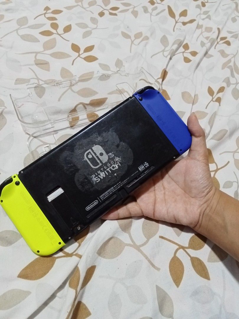 Nintendo Switch Console - Blue & Yellow Joy-Cons (Category: Nintendo) located in Rizal. Submitted by nykeri (Listing ID 1453122725, Image 2). Description: - Nintendo Switch Console - brandnew Blue and Yellow Joy-Cons - Includes clear protective case - Minor scuffing and dust on the back of the console - minor dents, scratches. - Fully functional and works well - with free game card.( sonic forces and bayonetta 2) .
