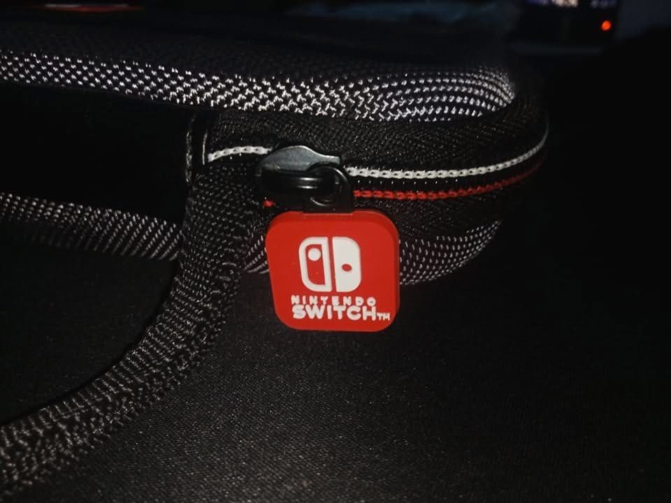 Nintendo Switch Lite Carrying Case with Screen Protector (Category: Nintendo) located in Cavite. Submitted by mikeyyyy10 (Listing ID 1453213060, Image 2). Description: - Hard shell carrying case for Nintendo Switch Lite - Includes screen protector and cleaning cloth - Secure zippered closure with red Nintendo Switch zipper pull - Interior mesh pocket for accessories - Molded insert for secure console fit - Ideal for travel and device protection.