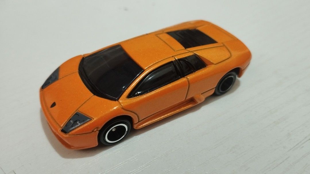 Tomica Lamborghini Murcielago (Category: Vehicle & Diecast Models) located in Santa Cruz. Submitted by .rx-78-2 (Listing ID 1453101260, Image 1). Description: - Lamborghini Murcielago - Features a nice metallic paint finish - Tinted windows for a sleek look - Black wheels with silver trim detail - Ideal for car collectors or as a gift for kids - Ready for its new owner!.