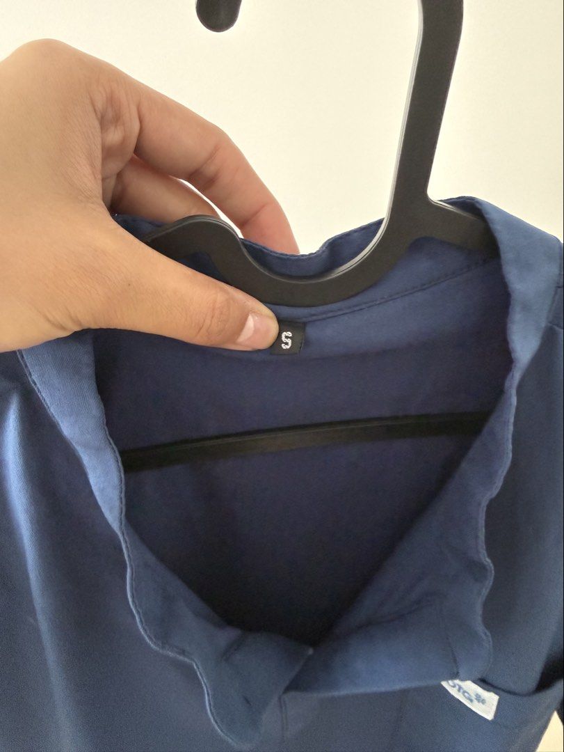 OTG Airstretch Scrubs Top (Category: Tshirts & Polo Shirts ) located in Pasig City. Submitted by riusables (Listing ID 1453095896, Image 3). Description: Authentic OTG Airstretch Mandarin Scrubs Top - Color: Deep Navy Blue - Features: Mandarin collar, chest pocket - Material: Airstretch for comfort - Style: Comfortable and stylish - Ideal for: Work or everyday wear made especially for medical professionals - Fit: Small for men but can be unisex -