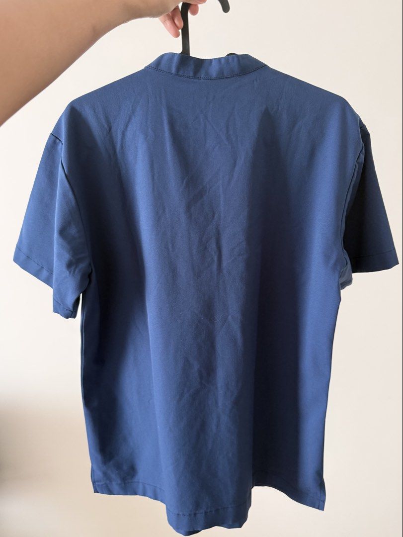 OTG Airstretch Scrubs Top (Category: Tshirts & Polo Shirts ) located in Pasig City. Submitted by riusables (Listing ID 1453095896, Image 2). Description: Authentic OTG Airstretch Mandarin Scrubs Top - Color: Deep Navy Blue - Features: Mandarin collar, chest pocket - Material: Airstretch for comfort - Style: Comfortable and stylish - Ideal for: Work or everyday wear made especially for medical professionals - Fit: Small for men but can be unisex -
