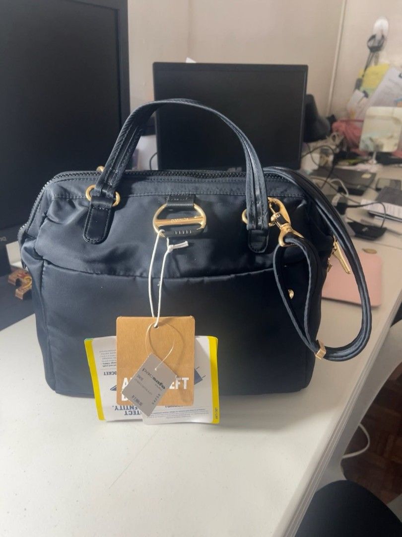 Pacsafe Black Satchel Bag - Anti-Theft, Secure Locking (Category: Cross-body Bags) located in Marikina City. Submitted by jabmar (Listing ID 1453073054, Image 2). Description: Pacsafe satchel bag in black Like New negotiable gor sure buyer Bought for 7990 - Lightweight and comfortable for daily use - Anti-theft features: Roobar locking system, Turnlock security hook - Ideal for travel and work - Spacious yet compact design RFS: Declutter.
