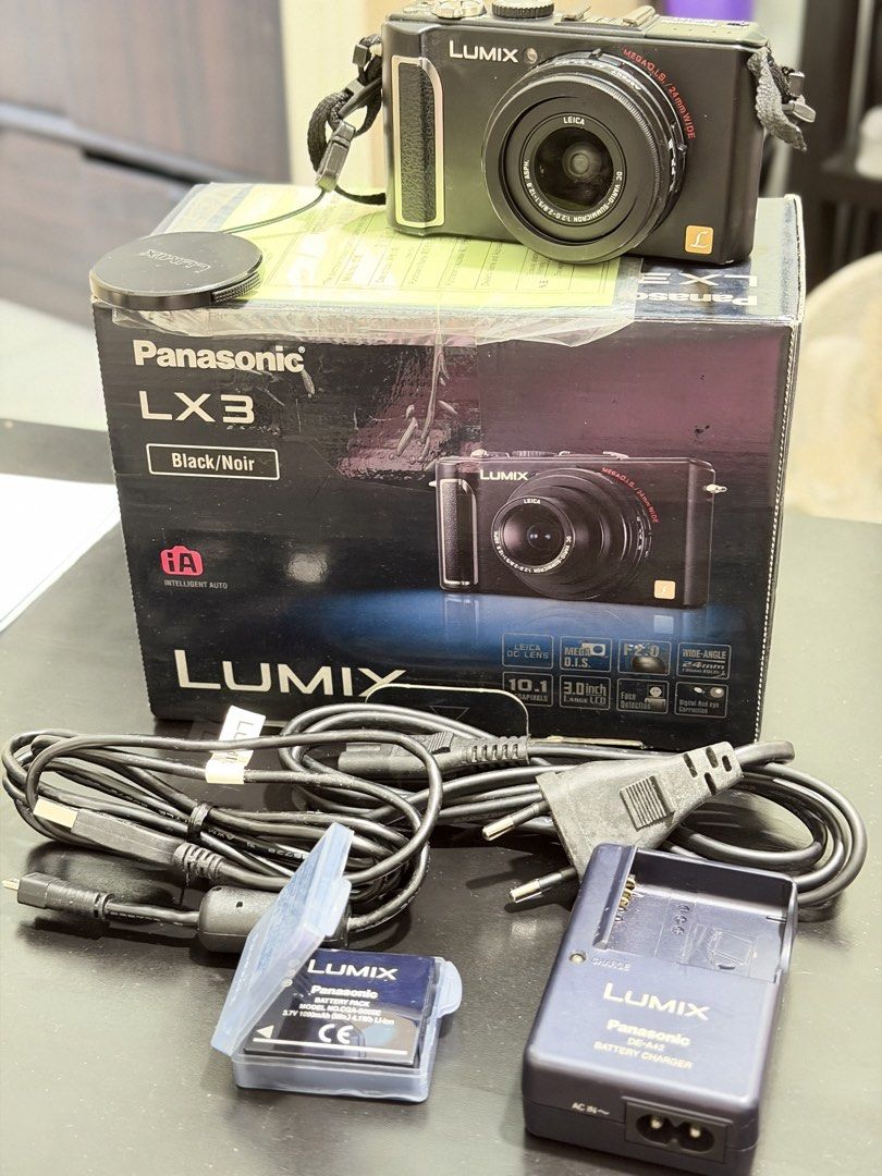 Panasonic Lumix LX3 Digital Camera with Box and Accessories (Category: Cameras) located in Makati City. Submitted by decluttersellmystuff (Listing ID 1453085880, Image 1). Description: - Panasonic Lumix LX3 Camera (Black) - Includes Original Box, Battery, Charger, and Cables - Ideal for capturing everyday moments - Minor Issue on LCD lense Negotiable .