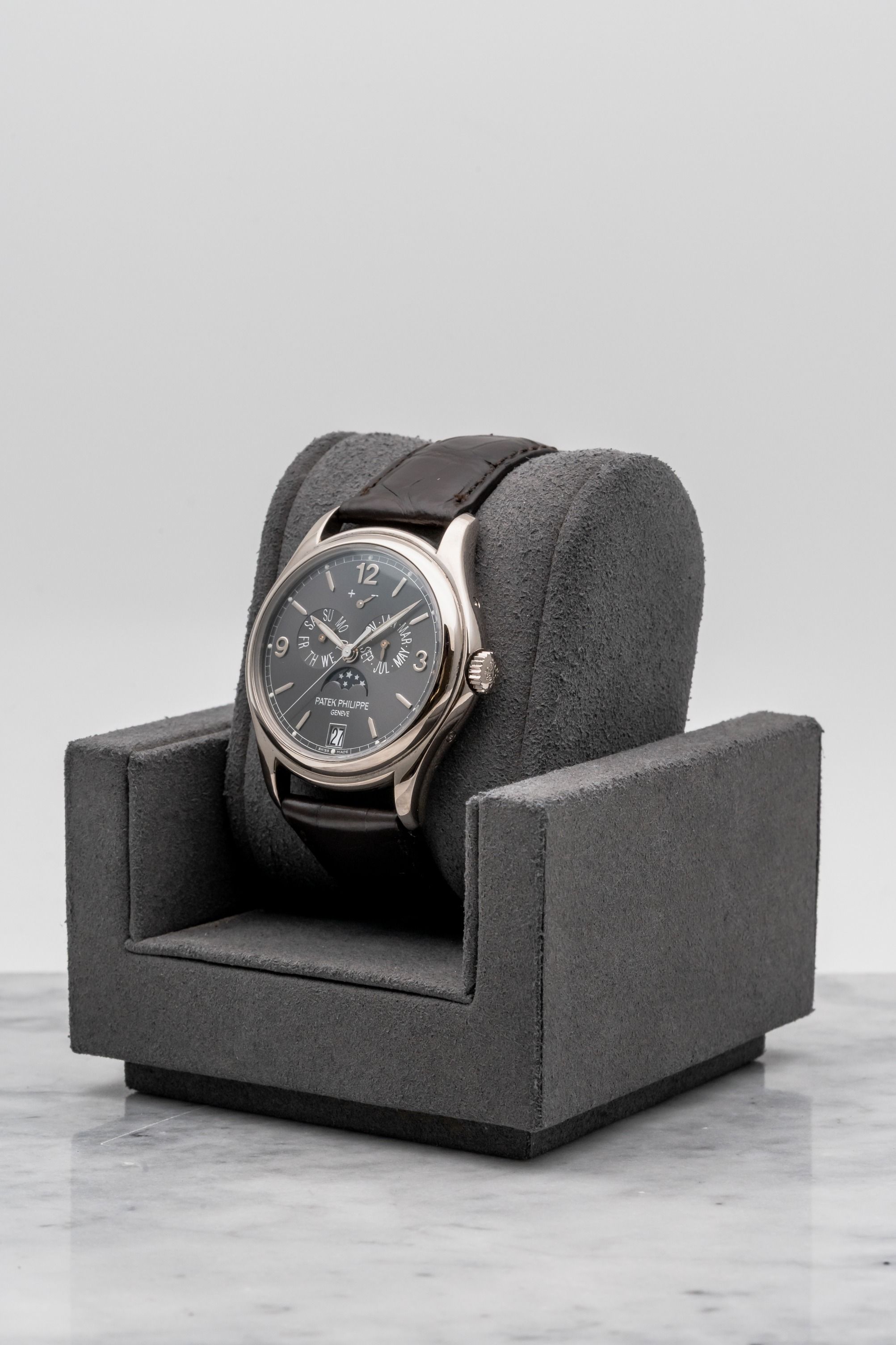 Patek Philippe Annual Calendar 5146G-010 Grey Dial • 2015 • 📦 & 📄 (Category: Watches) located in Singapore. Submitted by timetells (Listing ID 1453121494, Image 2). Description: Brand: Patek Philippe Model: Annual Calendar Reference Number: 5146G-010 Year: 2015 Case Size: 39 mm Case Material: 18K White Gold Dial: Grey Sunburst Dial with Applied White Gold Arabic Numerals and Baton Hour Markers, Annual Calendar, Moon Phase, Power Reserve Indicat