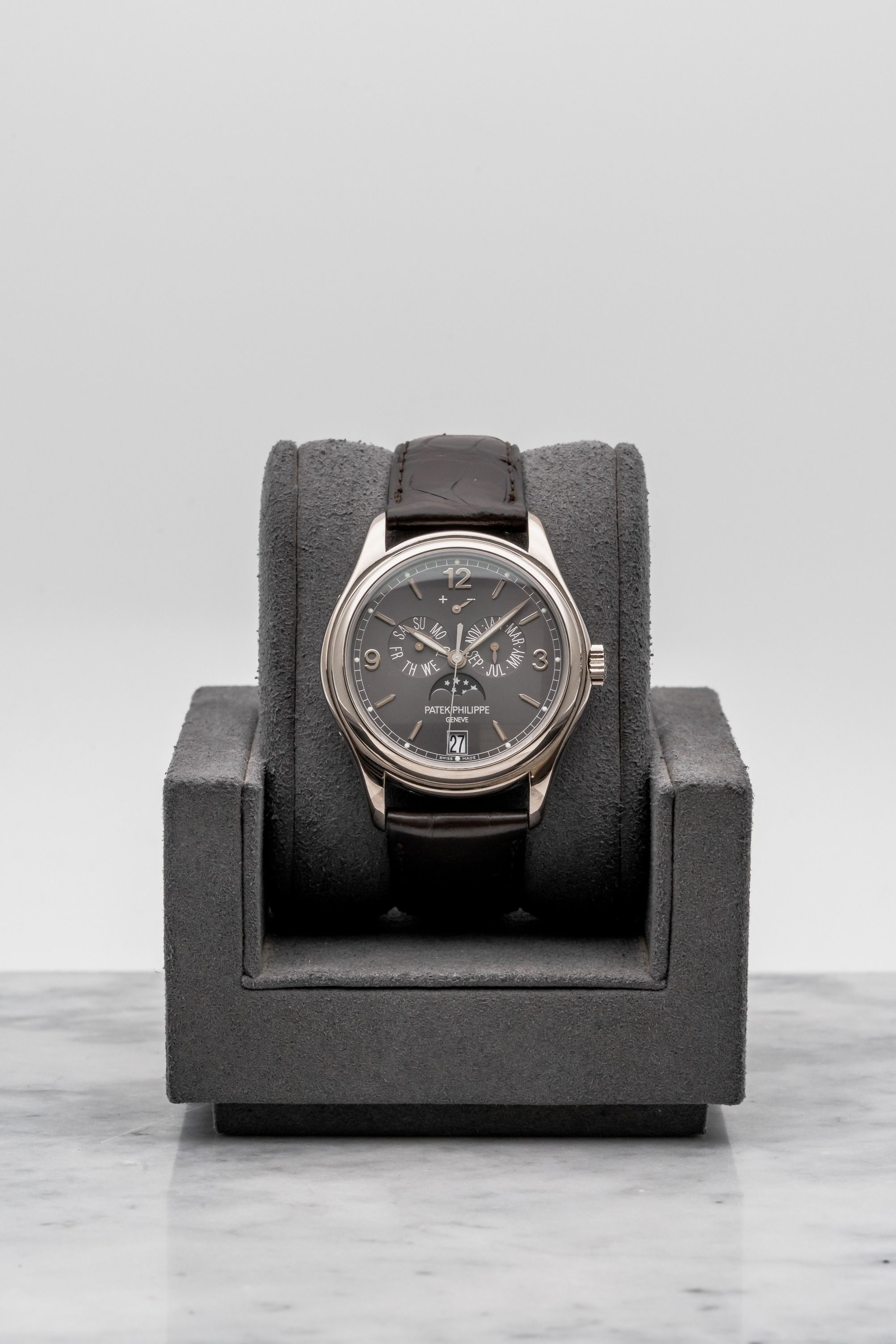 Patek Philippe Annual Calendar 5146G-010 Grey Dial • 2015 • 📦 & 📄 (Category: Watches) located in Singapore. Submitted by timetells (Listing ID 1453121494, Image 1). Description: Brand: Patek Philippe Model: Annual Calendar Reference Number: 5146G-010 Year: 2015 Case Size: 39 mm Case Material: 18K White Gold Dial: Grey Sunburst Dial with Applied White Gold Arabic Numerals and Baton Hour Markers, Annual Calendar, Moon Phase, Power Reserve Indicat