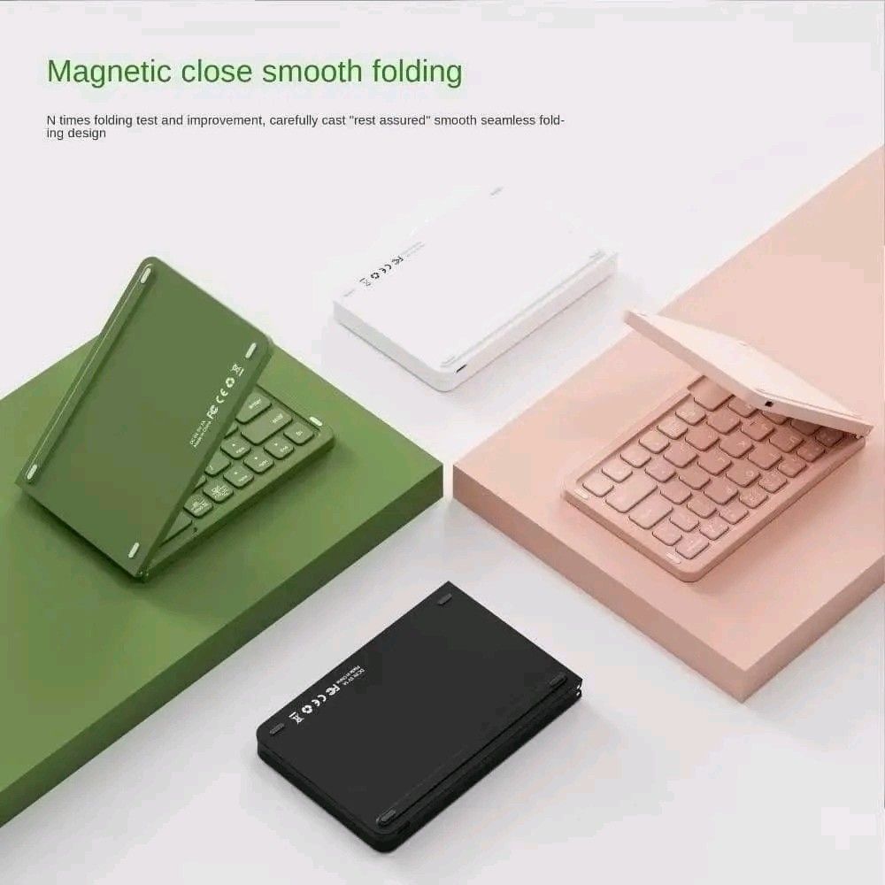 Portable Folding Bluetooth Keyboard for iOS/Android/Windows (Category: Computer Keyboard) located in Manila. Submitted by marvieobordo (Listing ID 1453175128, Image 3). Description: - Compact and foldable design - Bluetooth connectivity for iOS, Android, and Windows - Magnetic closure for secure folding - Auto wake/sleep function to conserve battery - Quiet scissor-foot key structure - Long standby time: 180 days - Available in various colors.