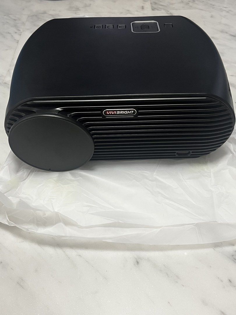 Projector (Category: Projectors) located in Singapore. Submitted by design.shopping (Listing ID 1453050889, Image 1). Description: - VIVIBRIGHT GP100 Projector - Top-end Home Theater - Android version - Brand New in box, never used before - Available in Basic or Android Versions - Includes: Owner's Manual, Remote Control, Power Adapter, Cables - Ideal for Movie Nights.