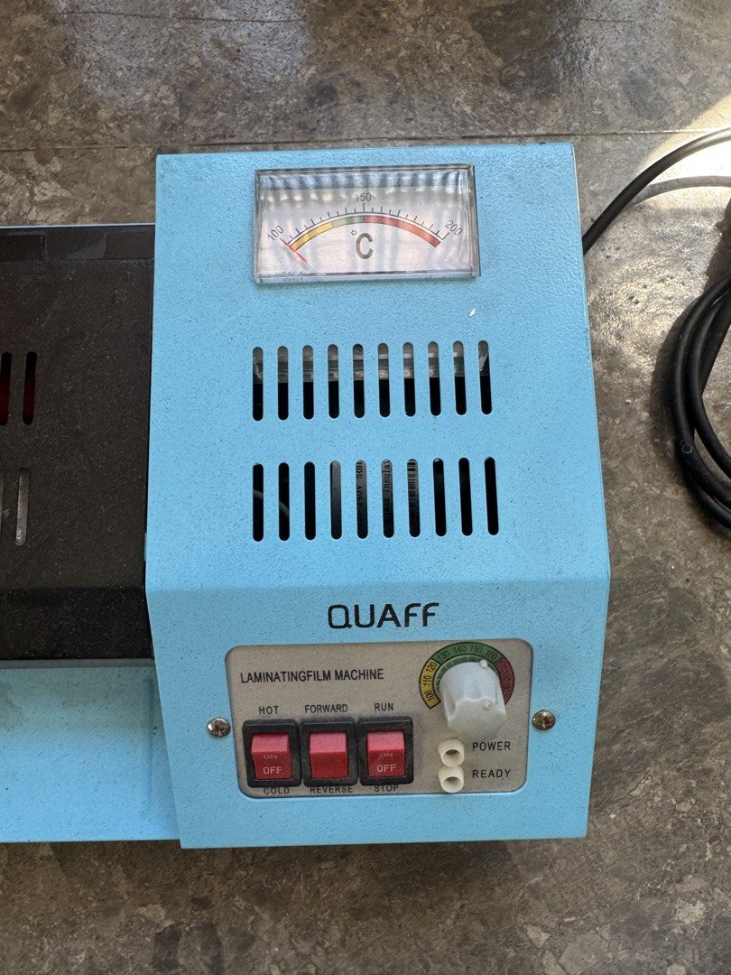 QUAFF Laminating Film Machine (Category: Printers, Scanners & Copiers) located in Pasig City. Submitted by wellnest (Listing ID 1453061643, Image 1). Description: - QUAFF Laminating Machine - Adjustable Temperature Control (up to 200°C) - Functions: Hot, Cold, Forward, Reverse, Stop - Power and Ready Indicator Lights - Perfect for Office or Home Use **Issue: ** Nafofold yung laminating film.