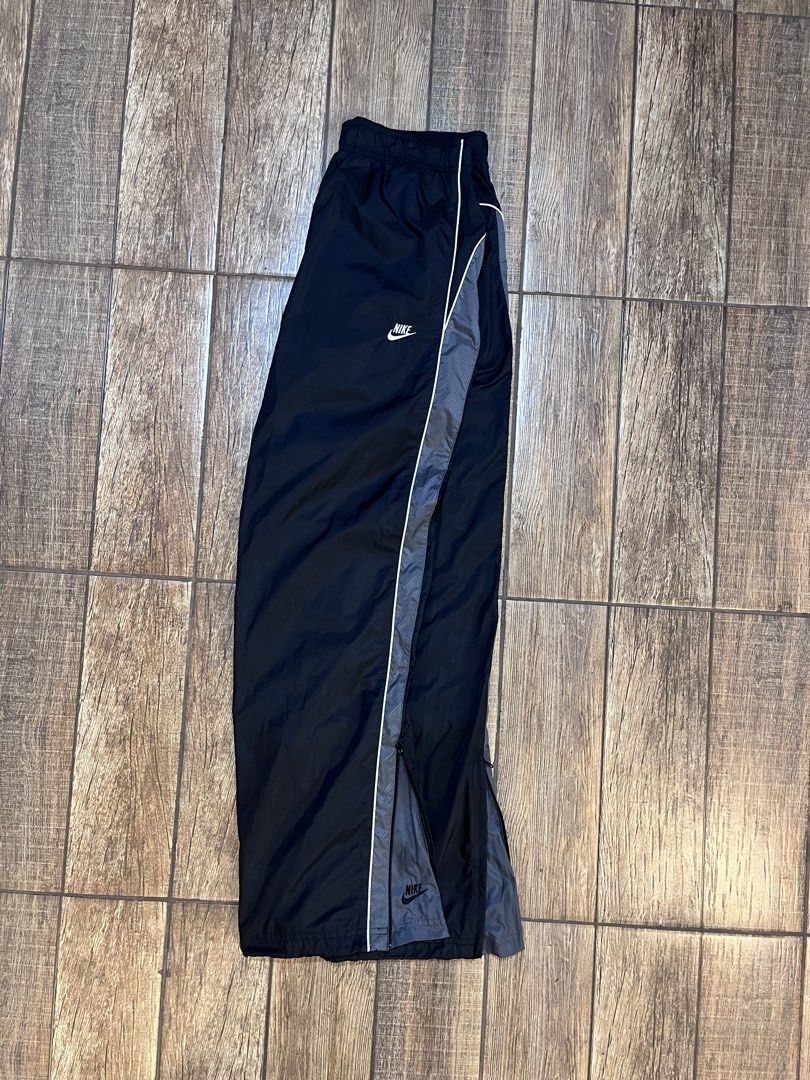 Rare Vintage Nike Trackpants Double Logo (Category: Joggers) located in Dagupan City. Submitted by harvey2005 (Listing ID 1453106043, Image 1). Description: prestine condition color rate 10/10 28-34 waistline 41 length issue: broken toggle stopper due to its age.