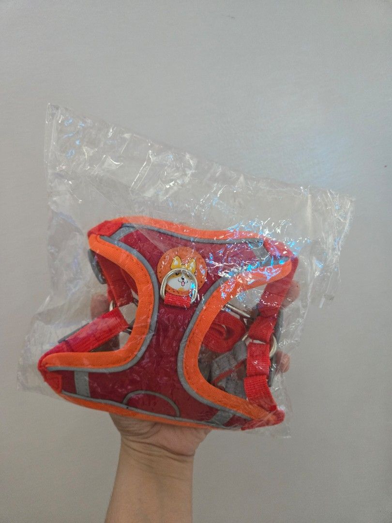 Red Pet Harness and Leash Set with Cute Fox Charm (Category: Homes & Other Pet Accessories) located in Quezon City. Submitted by samcas (Listing ID 1453087352, Image 1). Description: Red pet harness with orange trim and reflective stripes. Includes matching red leash. Features a cute fox charm. Adjustable straps. Size S. Perfect for walks!.