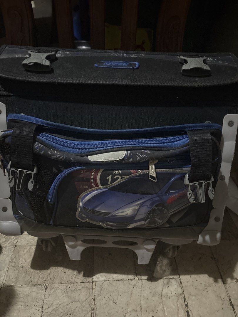 Robbie Rolling Trolley Backpack with Car Design (Category: Other Babies Going Out Needs) located in Quezon City. Submitted by happy_nanay_of_3 (Listing ID 1453050458, Image 1). Description: - Fun car graphic on the front pocket - Retractable handle and wheels for easy transport - Spacious main compartment - Additional front zippered pocket - Ideal for school or travel adventures.