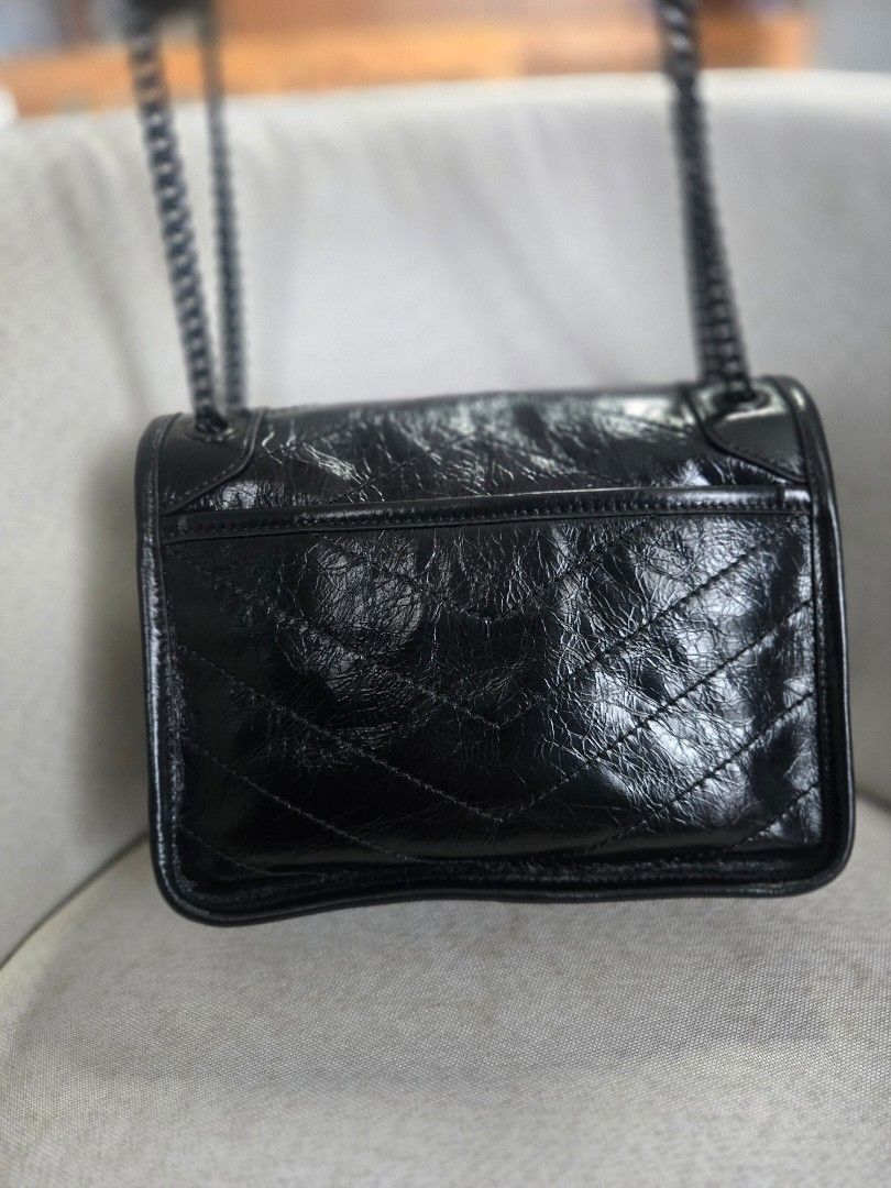 Saint Laurent Niki (Category: Luxury Bags & Wallets) located in Manila. Submitted by shla.dln (Listing ID 1453134624, Image 2). Description: - Japan bought thru pasabuy - Pls self authenticate - No heavy flaws - Comes with care cards and dust bag.