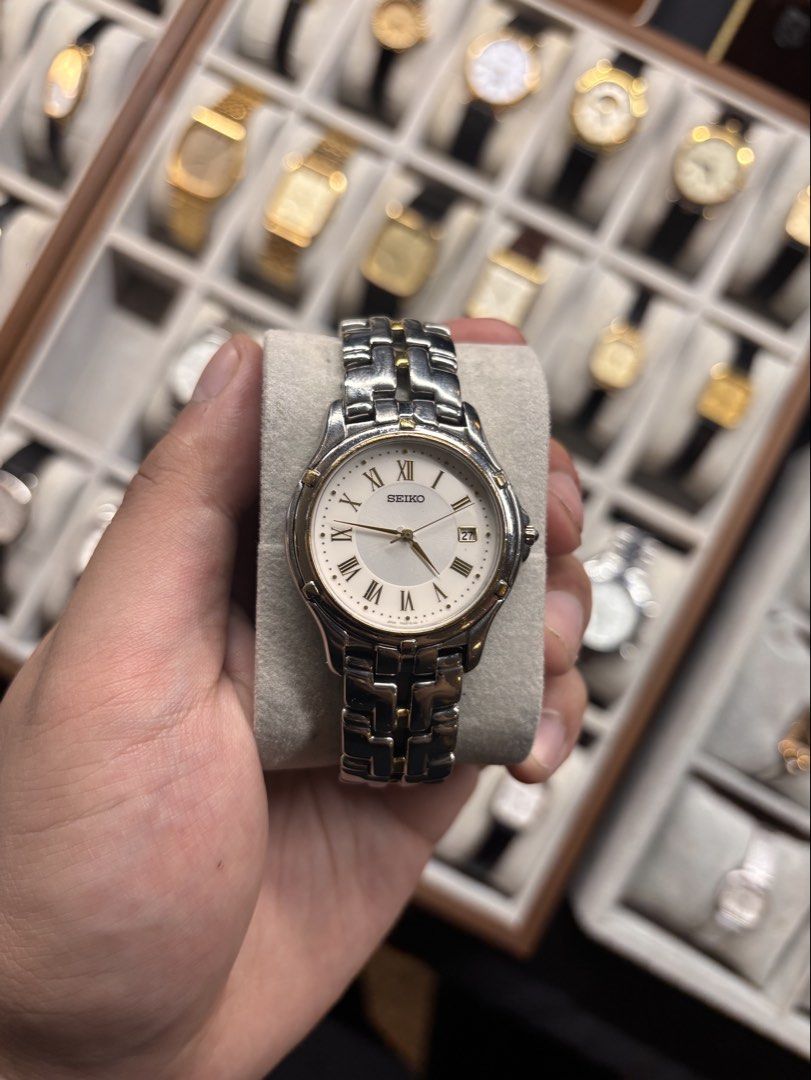 Seiko Two-Tone Roman Numeral Watch (Category: Luxury Watches) located in Quezon City. Submitted by kenhernando915 (Listing ID 1453160783, Image 1). Description: - Classic Seiko watch - Two-tone stainless steel band with gold accents - White dial with Roman numerals - Date window at 3 o'clock - Works well - Great for daily wear.
