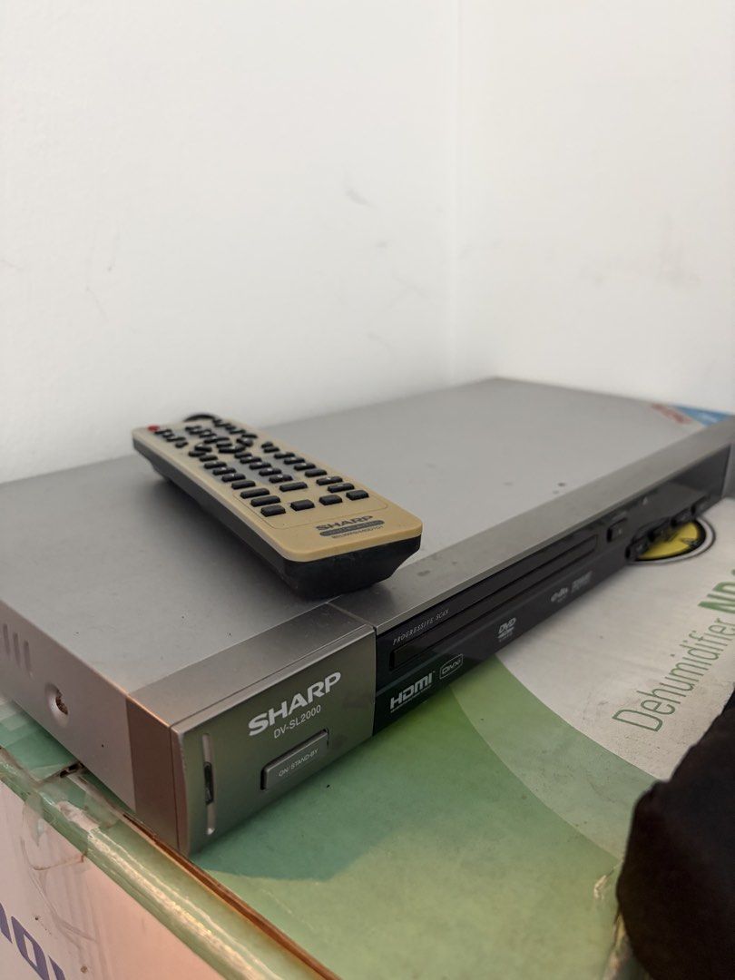 Sharp DVD player (Category: Blu-Ray & Media Players) located in Singapore. Submitted by humc13 (Listing ID 1453090136, Image 1). Description: Sharp DVD player DV-SL2000 Comes with remote.