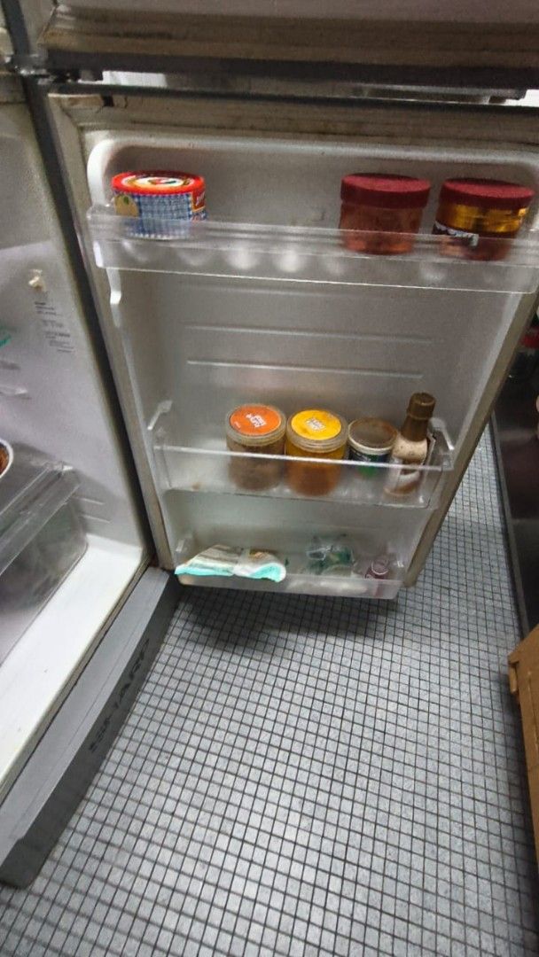 Sharp Refrigerator (Category: Refrigerators & Freezers) located in Kuala Lumpur. Submitted by samsed (Listing ID 1453097484, Image 3). Description: - Sharp Top Freezer Refrigerator - Ample storage space for groceries - Adjustable shelves for flexible organization - Minor cosmetic wear from normal use, fully functional - Perfect for students or small families - Pickup only.