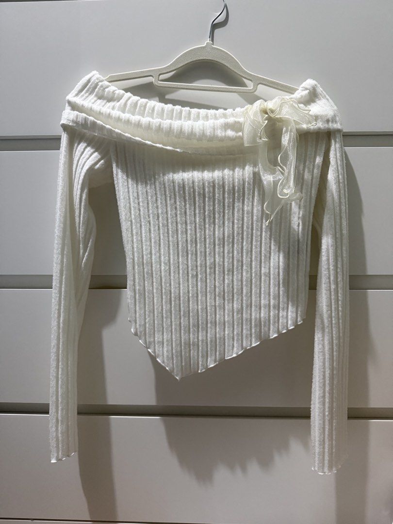 SHEIN MOD White Off-Shoulder Ribbed Long Sleeve Top (Category: Longsleeves) located in Manila. Submitted by RyzelHachi (Listing ID 1453227786, Image 1). Description: - White off-shoulder top - Long sleeves - Ribbed texture - Asymmetrical hemline - Sheer ribbon detail on neckline - SHEIN MOD style - Versatile for night out or casual wear.