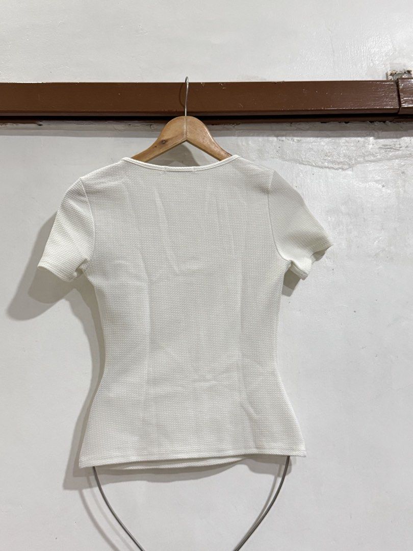 SHEIN White Textured Square Neck Top Tall S (Category: Blouses) located in Manila. Submitted by acluttering (Listing ID 1453164131, Image 3). Description: - SHEIN white textured top - Square neckline - Short sleeves - Fitted silhouette - Size: Tall S - Made in China - Versatile for casual or dressed-up occasions.