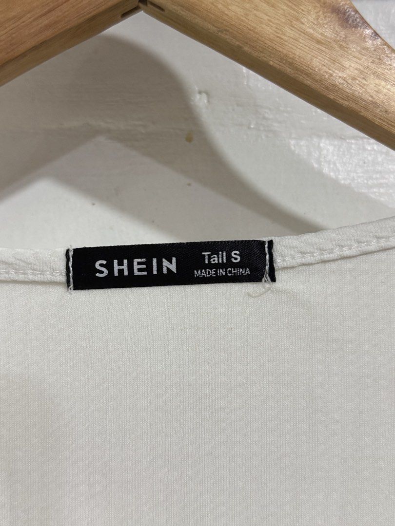 SHEIN White Textured Square Neck Top Tall S (Category: Blouses) located in Manila. Submitted by acluttering (Listing ID 1453164131, Image 2). Description: - SHEIN white textured top - Square neckline - Short sleeves - Fitted silhouette - Size: Tall S - Made in China - Versatile for casual or dressed-up occasions.