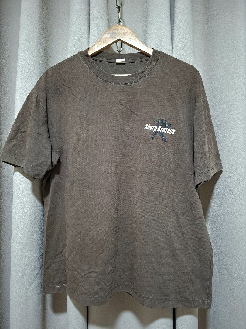 Sherp Grotask Graphic T-Shirt (Category: Tshirts & Polo Shirts ) located in Batangas. Submitted by sell_ph (Listing ID 1453051031, Image 1). Description: - Brand: Sherp Grotask - Color: Brown - Design: Graphic tee with 'Lost Management Cities' text on the back - Sleeves: Short sleeves - Neckline: Crew neck - Style: Casual wear.