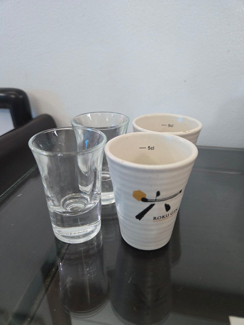 Shot Glasses (Category: Other Kitchenware & Tableware) located in Quezon City. Submitted by samcas (Listing ID 1453088232, Image 1). Description: Set of 4 shot glasses: 2 clear glass, 2 white ceramic Roku Gin glasses (5cl marked). Perfect for spirits. take all for only 200.