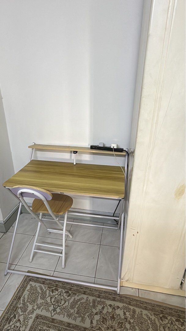 Study table (Category: Tables & Sets) located in Kuala Lumpur. Submitted by affhsykrh (Listing ID 1453087947, Image 1). Description: - Wood finish tabletop with sturdy metal frame - Folds flat for easy storage and portability - Perfect for small apartments, dorm rooms, or temporary workspaces - Includes a matching folding chair - Great for studying, working from home, or as a convenient side table.
