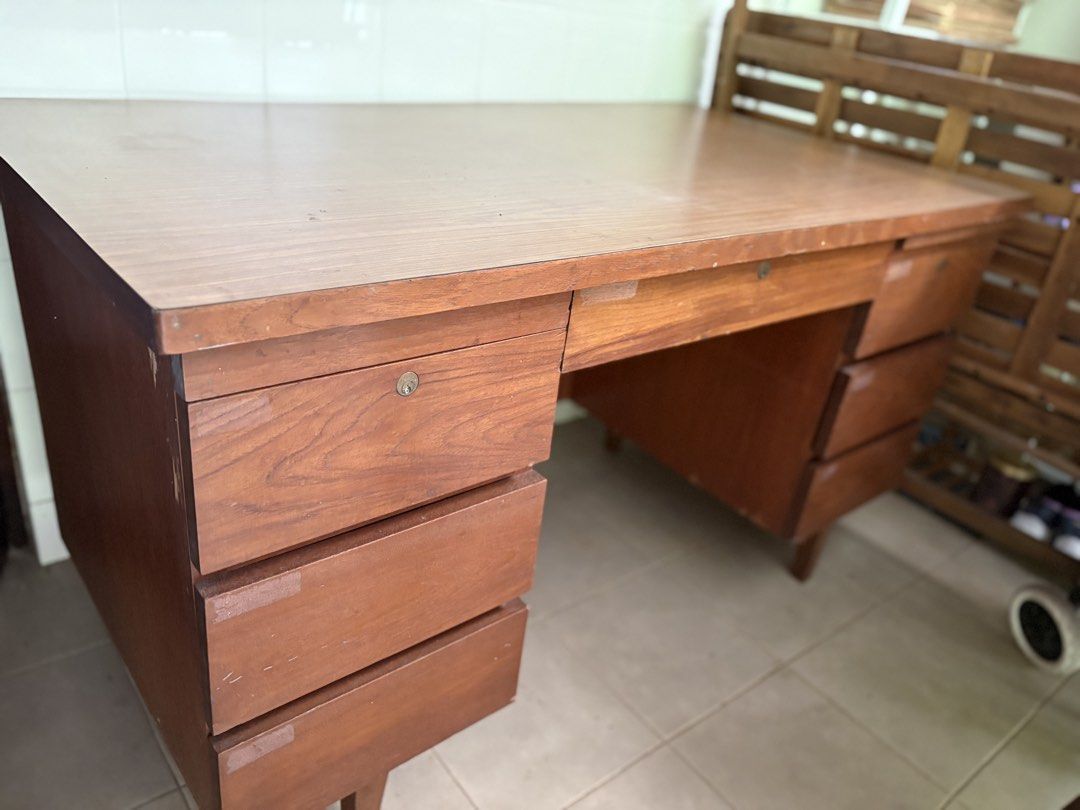 Study table (Category: Tables & Sets) located in Singapore. Submitted by joli11 (Listing ID 1453156590, Image 1). Description: Teak study table. Old style. Length 138cm, Width 76.5cm Height 76cm 3 drawers on each side 1 centre drawer All drawers working order. No key to drawers. Pay for own collection. .