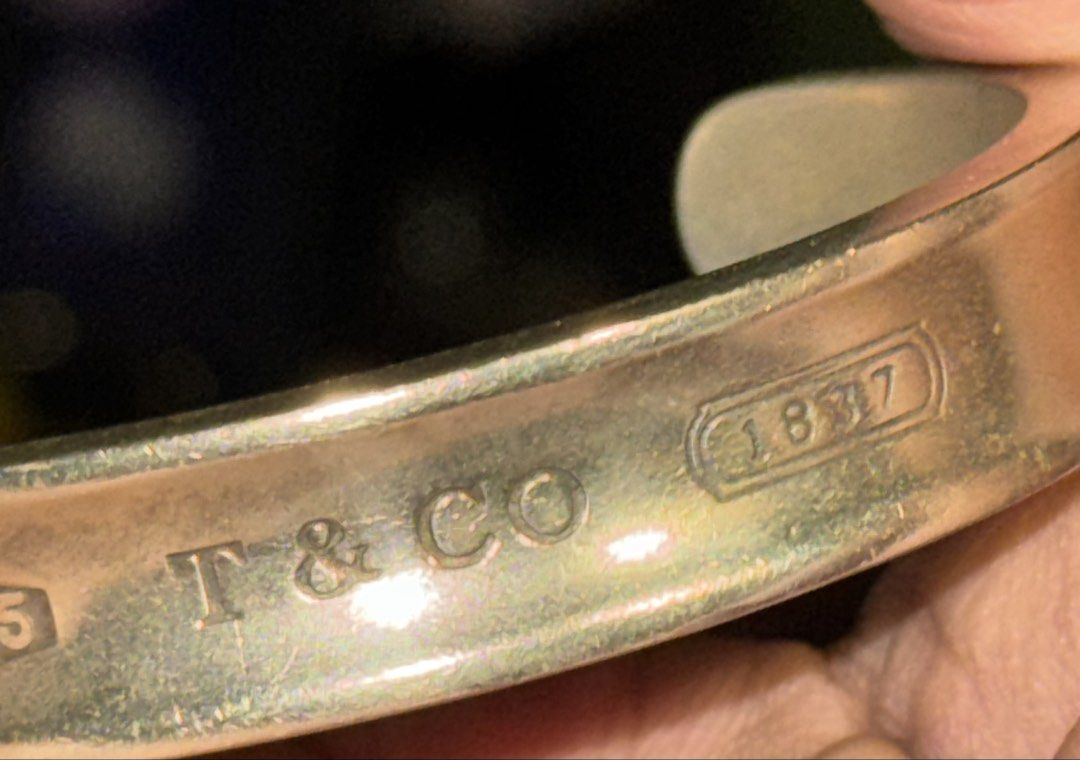 Tiffany & Co silver bangle (Category: Bracelets) located in Imus. Submitted by juantosell777 (Listing ID 1453186038, Image 2). Description: - Authentic Tiffany & Co. cuff bracelet - Crafted from 925 sterling silver - Features 'T & CO', '925', '1997', and '1837' hallmarks - Classic and timeless Tiffany design .