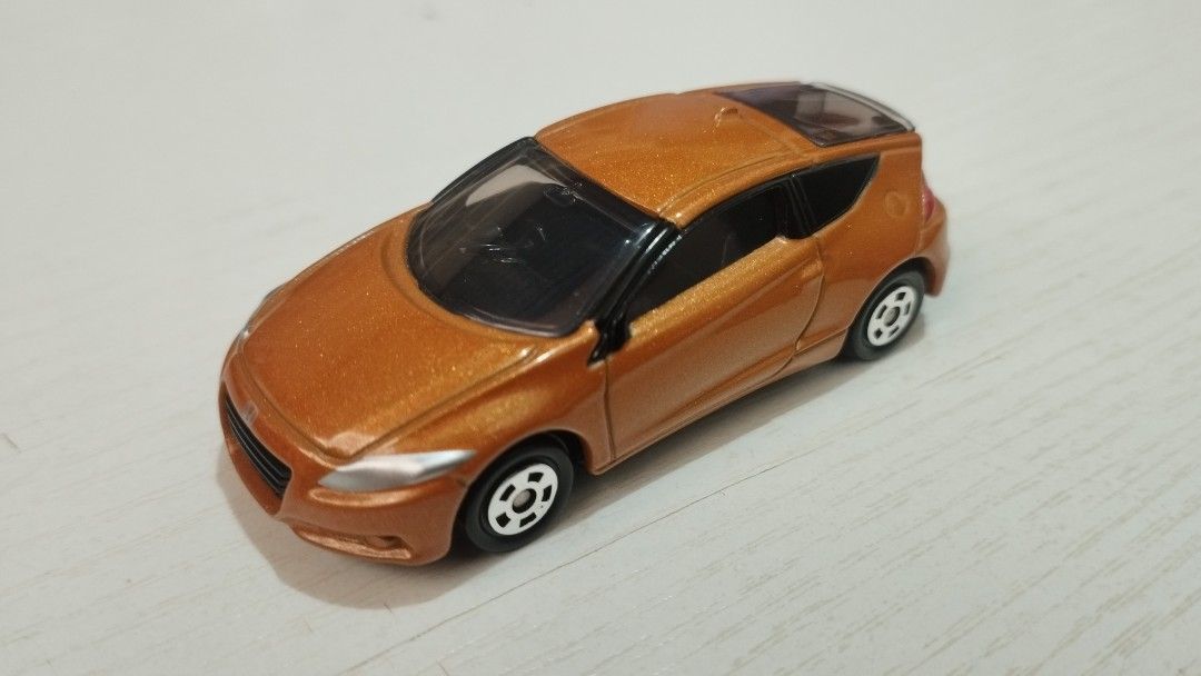 Tomica Honda CR-Z set (Category: Vehicle & Diecast Models) located in Santa Cruz. Submitted by .rx-78-2 (Listing ID 1453112365, Image 1). Description: - Two (2) Tomica Honda CR-Z hybrid diecast cars - Color 1: Metallic Orange - Color 2: Dark Grey with racing decals and number 18 - Highly detailed models - Ideal for collectors and display purposes.