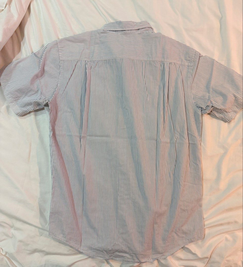 Uniqlo Blue and White Stripes Button Down Shirt (Category: Formal Shirts) located in Cebu City. Submitted by declutteringduo007 (Listing ID 1453184604, Image 3). Description: Uniqlo Blue and White Stripes Button Down Shirt Size: S.