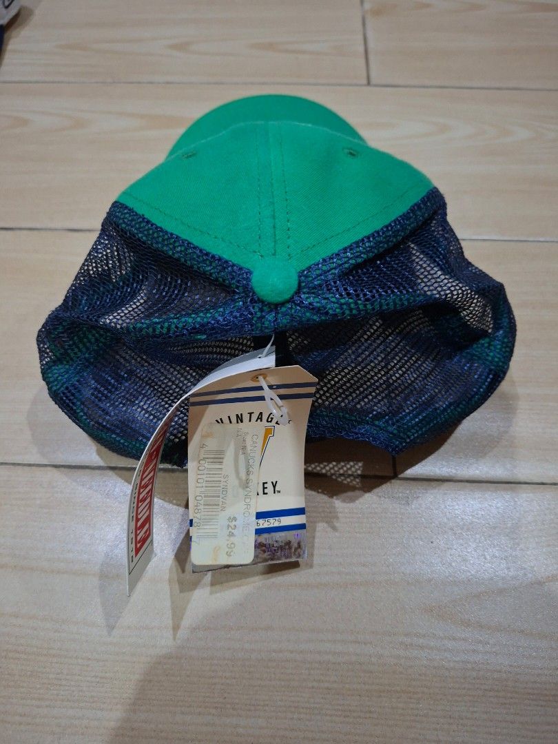 Vancouver Canucks Syndrome Cap (Category: Caps & Hats) located in Quezon City. Submitted by decluttersaleph (Listing ID 1453222363, Image 2). Description: - Green Vancouver Canucks trucker cap - Mesh back for breathability - Brand new with original tags attached - One Size.