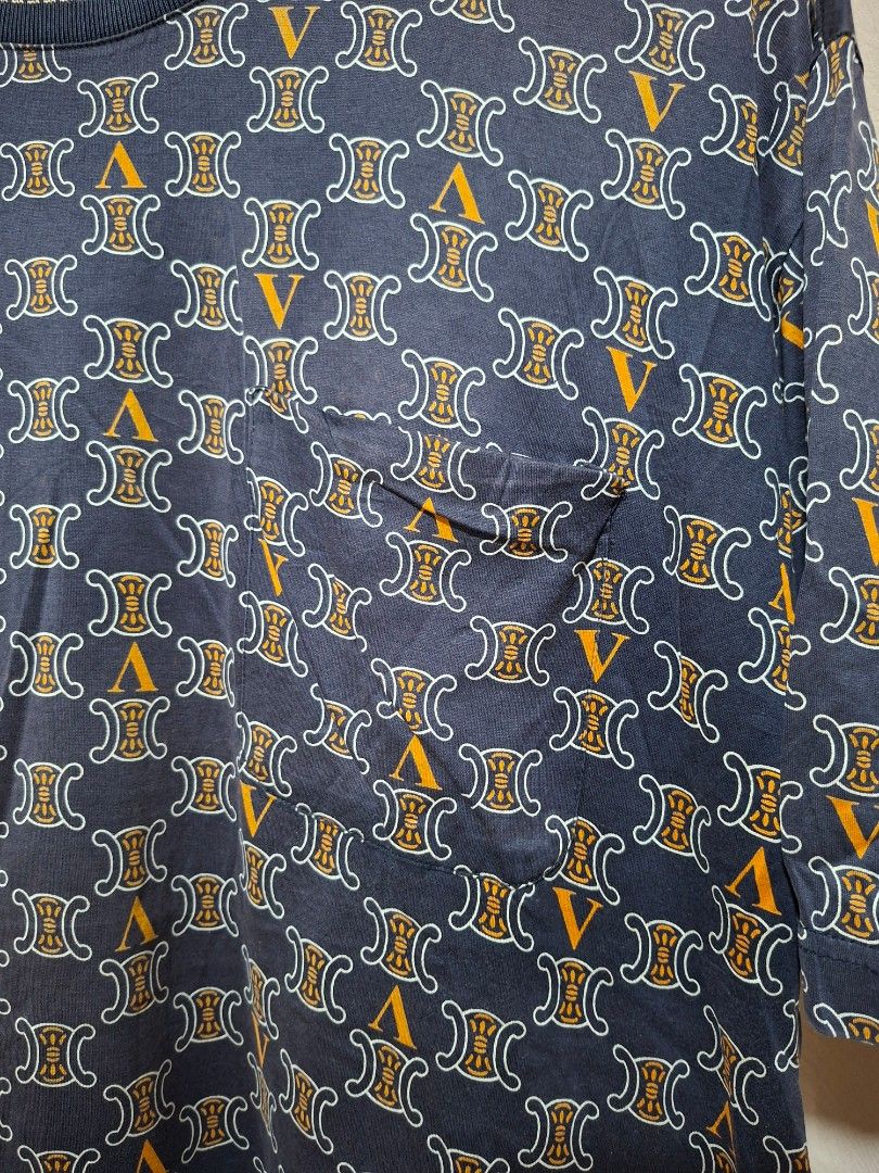Versace Jacket Couture All Over Print T-Shirt (Category: Tshirts & Polo Shirts ) located in Batangas. Submitted by sell_ph (Listing ID 1453050984, Image 2). Description: - Navy blue Versace T-shirt - Size 52 - All-over print featuring iconic Medusa head and Greca pattern - Chest pocket detail - Ideal for any Versace fan.
