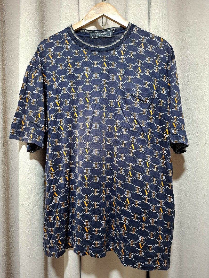 Versace Jacket Couture All Over Print T-Shirt (Category: Tshirts & Polo Shirts ) located in Batangas. Submitted by sell_ph (Listing ID 1453050984, Image 1). Description: - Navy blue Versace T-shirt - Size 52 - All-over print featuring iconic Medusa head and Greca pattern - Chest pocket detail - Ideal for any Versace fan.
