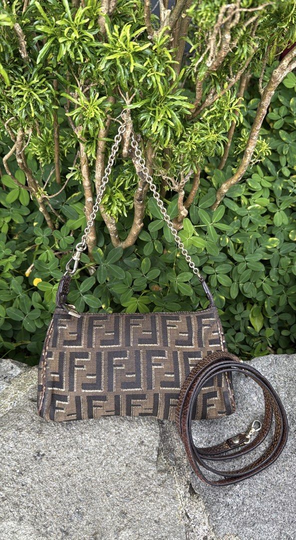 VINTAGE FENDI BAGUETTE (Category: Luxury Bags & Wallets) located in Baguio. Submitted by closetgc.clothingshop (Listing ID 1453070082, Image 1). Description: Vintage Fendi baguette Can be used as 2 way, Guaranteed Authentic Monogram design , Snake skin like strap and a chain strap all orig. Still in excellent condition for a vintage bag, clean inside and out. .