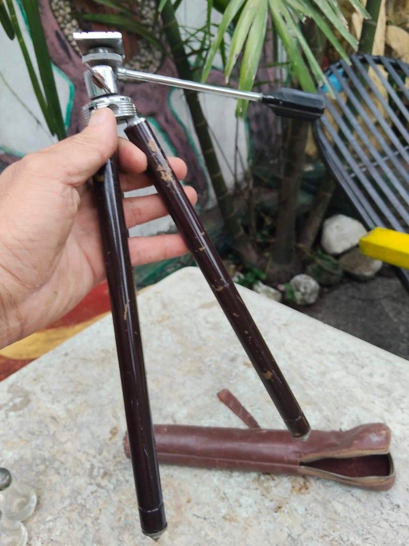 Vintage Mini Tripod with Leather Case (Category: Tripods & Monopods) located in Caloocan City. Submitted by kaymatias (Listing ID 1453205078, Image 3). Description: - Compact vintage tripod - Folds down small for easy storage - Includes original dark brown leather case made of stainless/brass - Dark brown legs with silver accents - Ideal for travel or small cameras-.