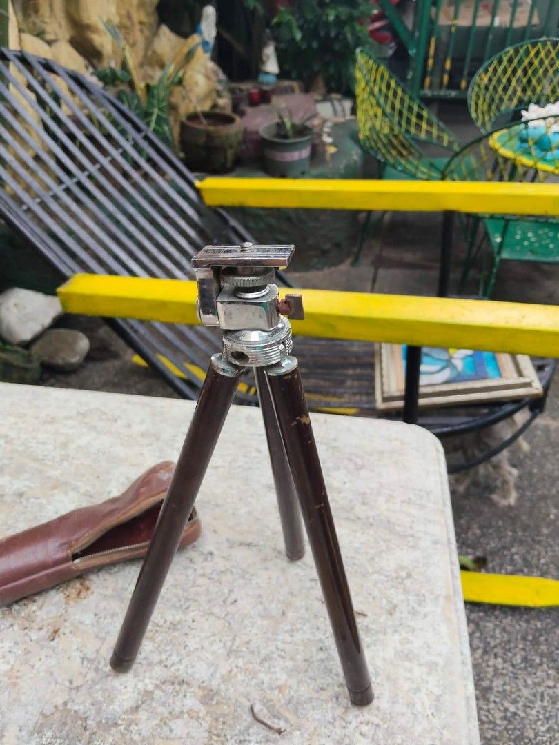 Vintage Mini Tripod with Leather Case (Category: Tripods & Monopods) located in Caloocan City. Submitted by kaymatias (Listing ID 1453205078, Image 2). Description: - Compact vintage tripod - Folds down small for easy storage - Includes original dark brown leather case made of stainless/brass - Dark brown legs with silver accents - Ideal for travel or small cameras-.