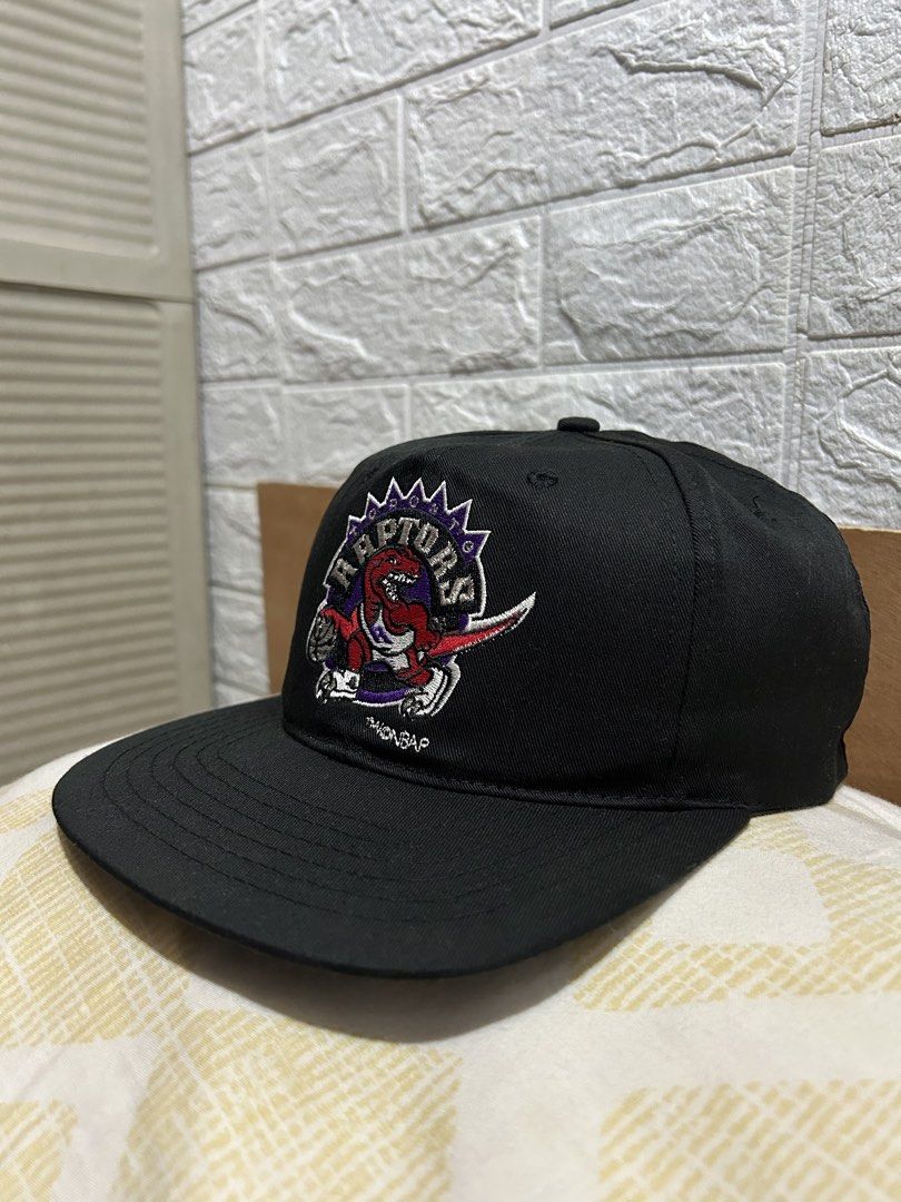 Vintage Toronto Raptors Starter NBA Snapback Cap (Category: Caps & Hats) located in Baguio. Submitted by don_ben (Listing ID 1451040016, Image 1). Description: - Classic Toronto Raptors snapback cap - Features the iconic Raptors logo on the front - Starter branding on the back - Made with a comfortable 65% polyester, 35% cotton blend - Adult size with an adjustable snap for a custom fit.