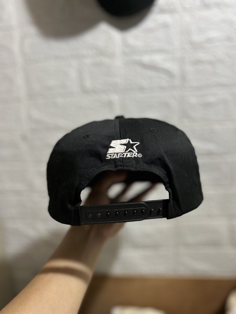 Vintage Toronto Raptors Starter NBA Snapback Cap (Category: Caps & Hats) located in Baguio. Submitted by don_ben (Listing ID 1451040016, Image 3). Description: - Classic Toronto Raptors snapback cap - Features the iconic Raptors logo on the front - Starter branding on the back - Made with a comfortable 65% polyester, 35% cotton blend - Adult size with an adjustable snap for a custom fit.