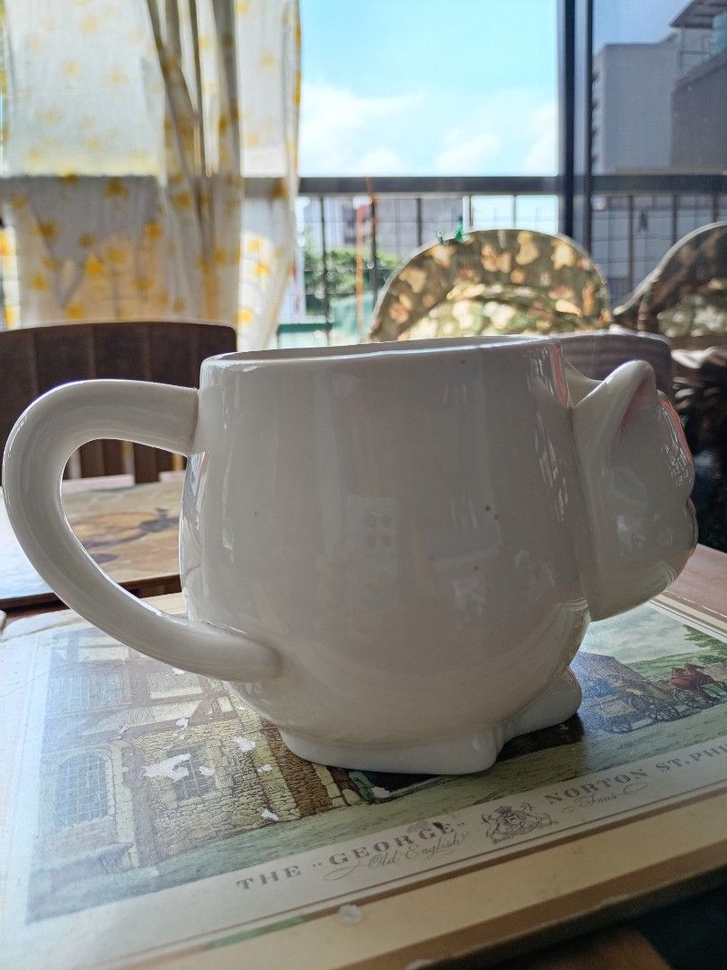 White Ceramic Cat Mug with Handle (Category: Coffee & Tea Tableware) located in Makati City. Submitted by meowmyella (Listing ID 1453060167, Image 3). Description: - Adorable white ceramic mug shaped like a cat. - Features a convenient side handle. - Ideal for your morning coffee or tea. - A fun and charming gift for any cat lover. Kindly send DM for more details.