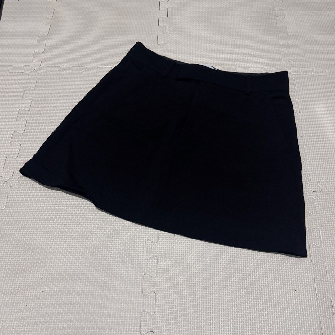 ZARA Black Mini Skirt (Category: Skirts) located in Marikina City. Submitted by prelovedsms (Listing ID 1453212597, Image 1). Description: - ZARA Black Mini Skirt - Size: S - Classic tailored style - Features belt loops - Zip fly with button closure - Versatile for work or casual outfits - Measurements provided in photos.