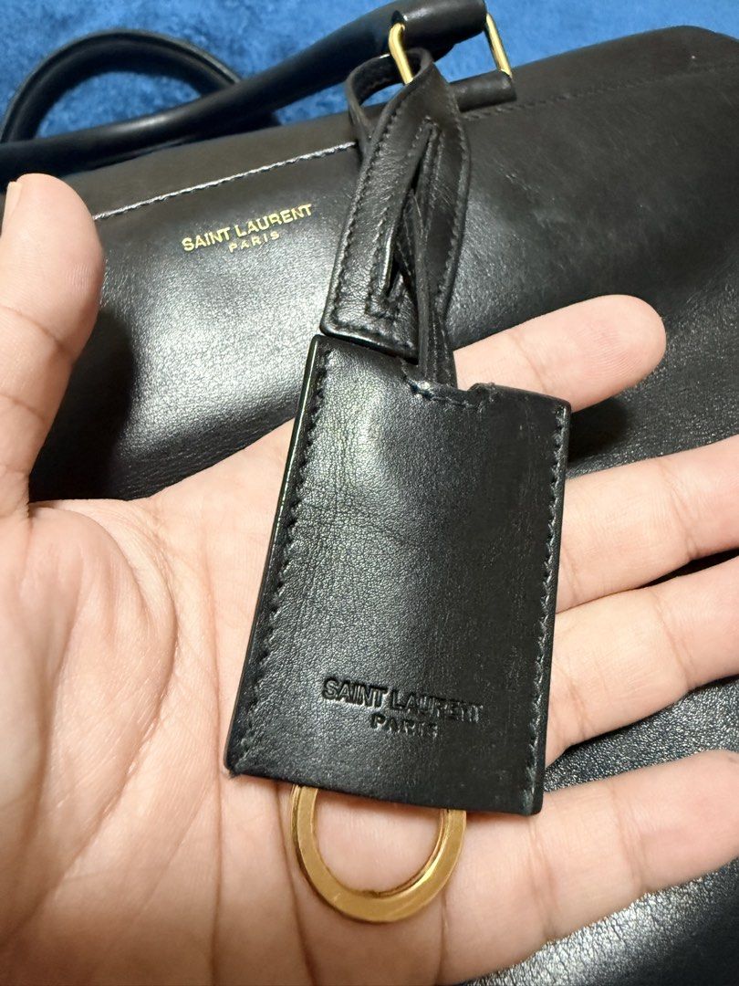 💯 YSL Duffle Bag (Category: Luxury Bags & Wallets) located in Paranaque City. Submitted by boxelle (Listing ID 1454858287, Image 3). Description: 💯 YSL Duffle bag Black with gold hardware Medium, can fit ipad air 7 11inch Payment options: GCash or Bank via QR Credit card via wize app NO TO LOWERBALLERS SF included, options below only: Within Metro Manila via Lalamove Outside MM via LBC .