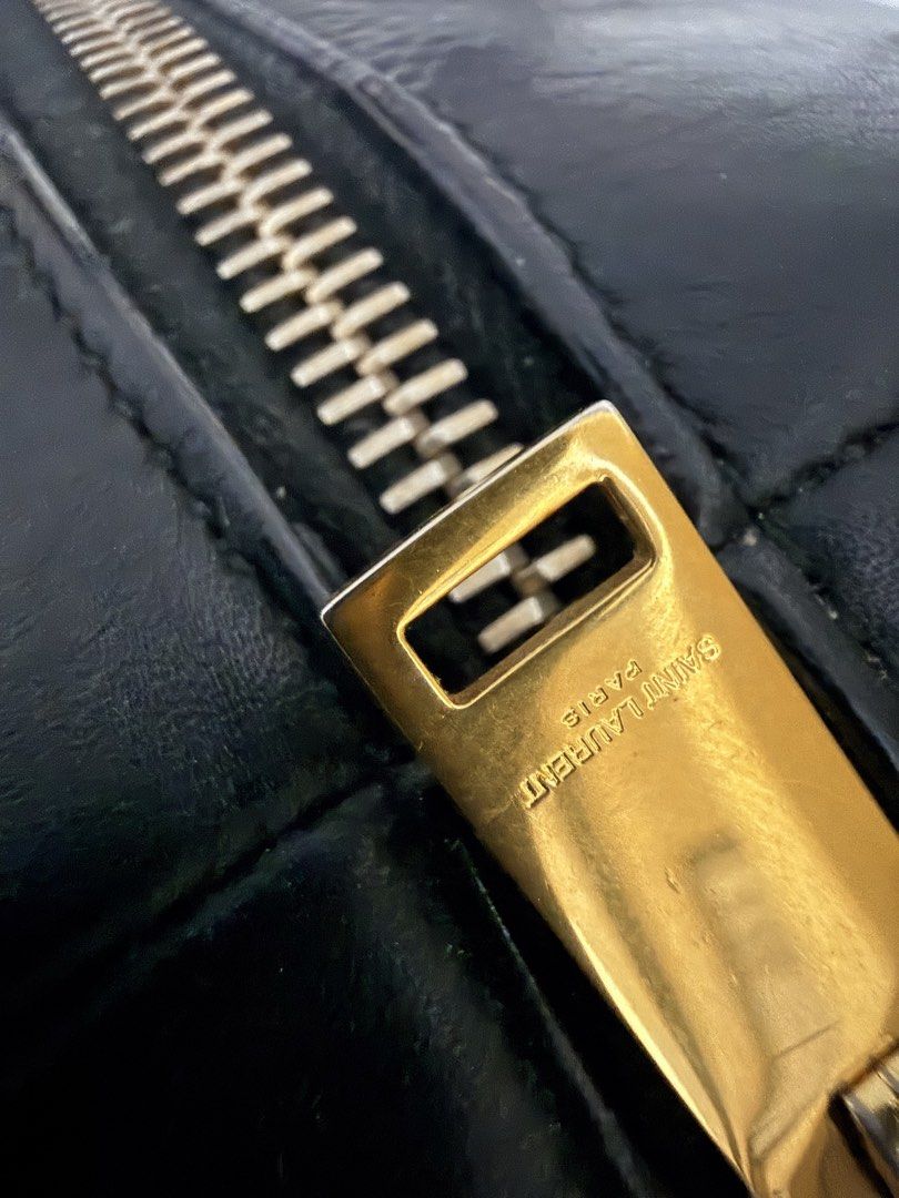 💯 YSL Duffle Bag (Category: Luxury Bags & Wallets) located in Paranaque City. Submitted by boxelle (Listing ID 1454858287, Image 2). Description: 💯 YSL Duffle bag Black with gold hardware Medium, can fit ipad air 7 11inch Payment options: GCash or Bank via QR Credit card via wize app NO TO LOWERBALLERS SF included, options below only: Within Metro Manila via Lalamove Outside MM via LBC .