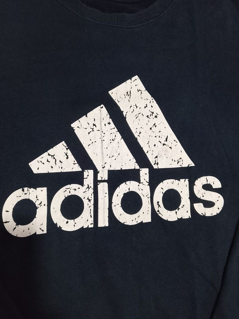 ADIDAS NAVY BLUE ESSENTIALS CREWNECK SWEATSHIRT (Category: Coats, Jackets and Outerwear) located in Mexico. Submitted by thethrift010203 (Listing ID 1454828417, Image 3). Description: OFF/LEGIT ADIDAS NAVY BLUE ESSENTIALS CREWNECK SWEATSHIRT Color : NAVY BLUE Fabic : 100% COTTON Size on tag: XL Kasya sa SMALL to MEDIUM sobrang fit sa LARGE sobrang ganda, STRETCHABLE Width : 21.1 Length : 25 Condition : excellent condition Issue : CRACKED LOGO MOP