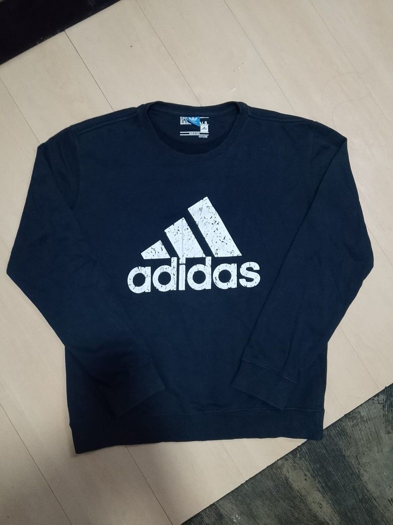 ADIDAS NAVY BLUE ESSENTIALS CREWNECK SWEATSHIRT (Category: Coats, Jackets and Outerwear) located in Mexico. Submitted by thethrift010203 (Listing ID 1454828417, Image 2). Description: OFF/LEGIT ADIDAS NAVY BLUE ESSENTIALS CREWNECK SWEATSHIRT Color : NAVY BLUE Fabic : 100% COTTON Size on tag: XL Kasya sa SMALL to MEDIUM sobrang fit sa LARGE sobrang ganda, STRETCHABLE Width : 21.1 Length : 25 Condition : excellent condition Issue : CRACKED LOGO MOP