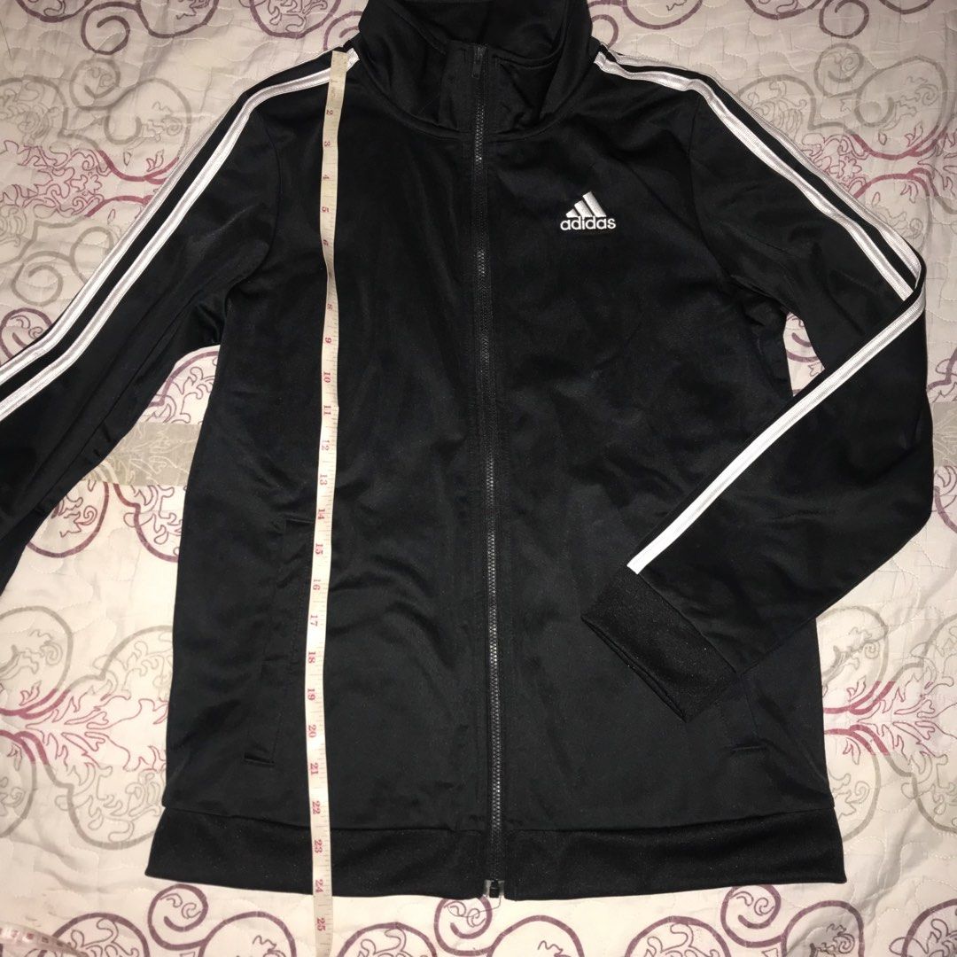 Adidas Track Jacket Black White Stripes (Category: Coats, Jackets and Outerwear) located in Caloocan City. Submitted by ynasxi (Listing ID 1454842968, Image 3). Description: - Classic black Adidas track jacket - Full zip closure - Stand-up collar - Measurements: Length 24 inches, Chest 18 inches.