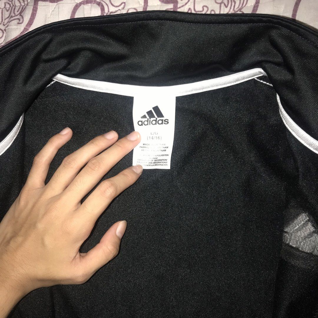 Adidas Track Jacket Black White Stripes (Category: Coats, Jackets and Outerwear) located in Caloocan City. Submitted by ynasxi (Listing ID 1454842968, Image 2). Description: - Classic black Adidas track jacket - Full zip closure - Stand-up collar - Measurements: Length 24 inches, Chest 18 inches.